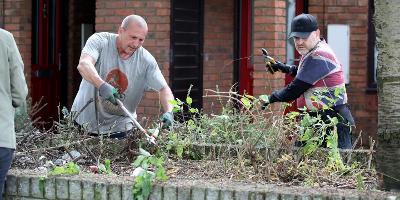 Volunteers preparing a planter at Arlington Street in Stockton