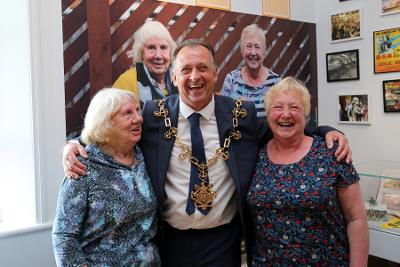 Mayor Faulks with exhibition contributors and best friends Brenda (left) and Jean (right). 