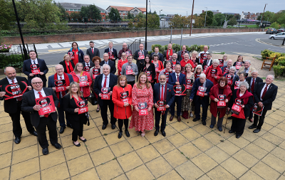 Stockton-on-Tees Borough Council councillors and officers wear red and hold posters to show their support for the Show Racism the Red Card campaign.