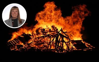 Dramatic stock image of a bonfire in darkness with a headshot pic of Cllr Norma Stephenson superimposed in the top left corner