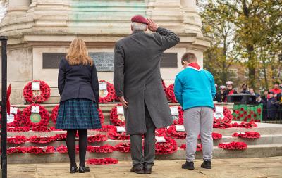 Veteran takes the salute alongside a young boy and girl at the Remembrance Sunday parade Stockton 2022