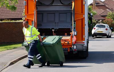 a waste operative collecting waste from a residential street in Stockton.