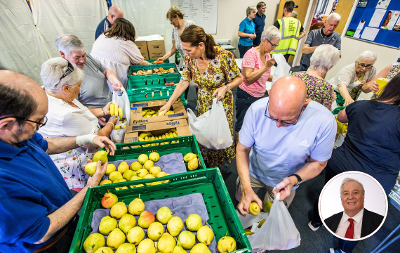 An image of volunteers at a Bread and Butter Thing Hub. In the bottom right corner is a headshot of Councillor Bob Cook