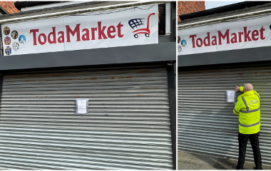 Shutters down on shop front with closure order being added