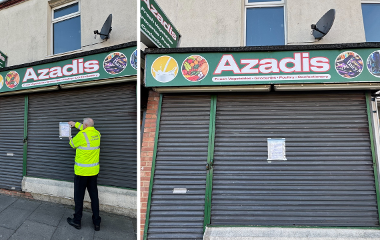 Shutters down on shop front with closure order being added